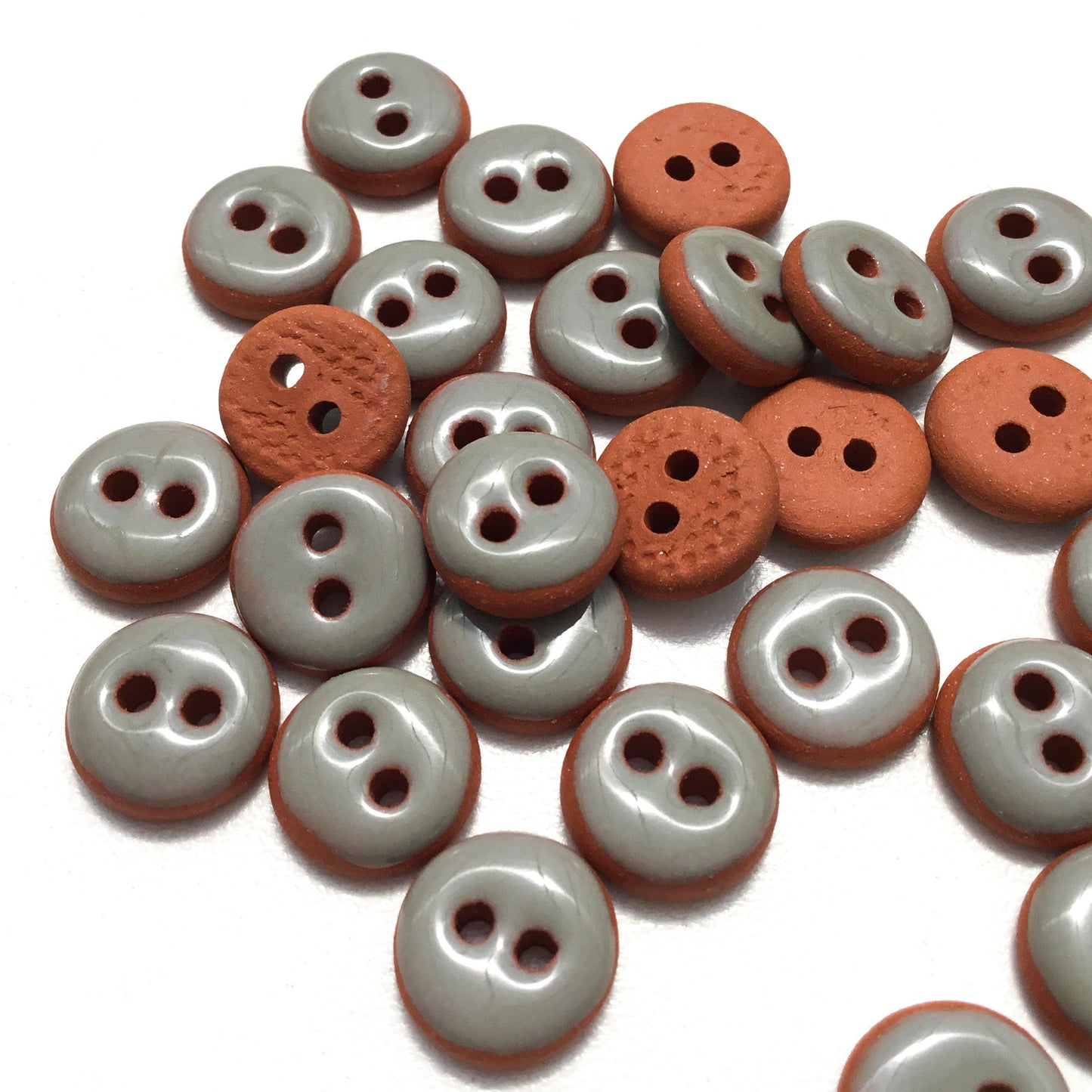 Gray Ceramic Buttons on Red Clay - 7/16"