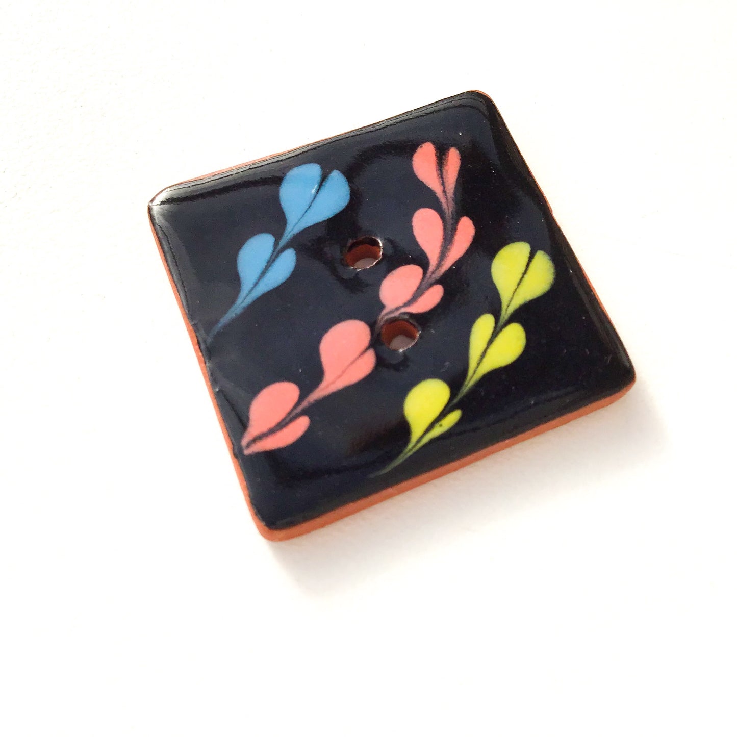 Black Ceramic Button with Chartreuse, Coral, & Blue Detail - Decorative Clay Buttons - 1 1/16"