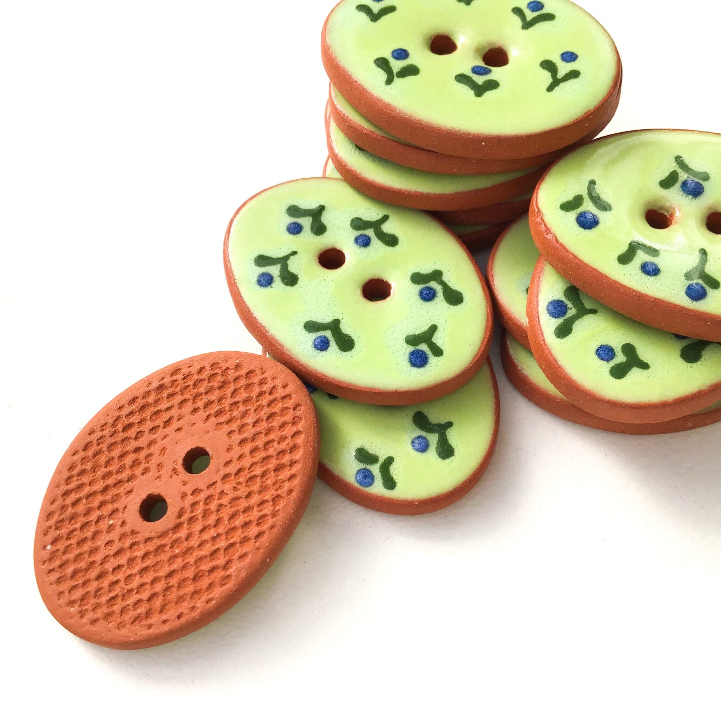 Green Ceramic Buttons with Small Blue Flowers 3/4" x 1-1/16"