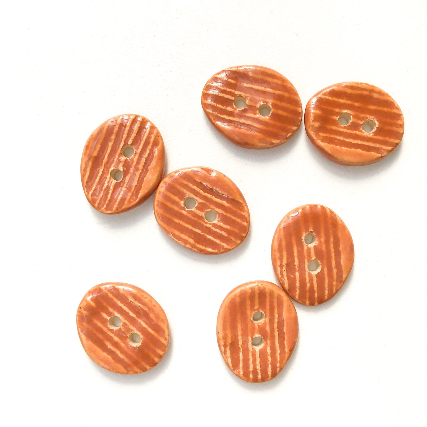 Orangish-Brown Textured Ceramic Buttons  9/16" x 11/16" - 7 Pack